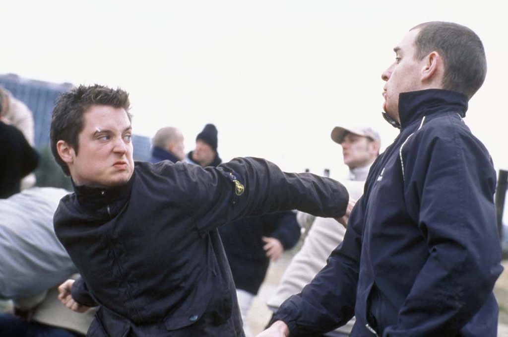 Pictured: Matt Bucker (ELIJAH WOOD) throws a punch at a member of the rival firm.