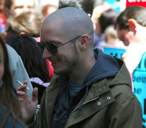 Actor Elijah Wood gets rid of his nice guy images as he sports a shaved head and tattoo as he films scenes for an upcoming movie in New York.The star walked around during a break in filming Day Zero and smoked a cigaretteAlso pictured on set with Elijah is actor Chris Klein<P><B>Ref: SGNY 300406 A EXCLUSIVE  </B><P><B>Splash News and Pictures</B><br>Los Angeles:	310-821-2666<br>New York:	212-619-2666<br>London:	207-107-2666<br>photodesk@splashnews.com