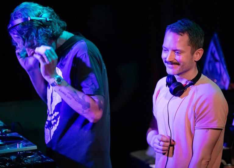 Elijah Wood spins vinyl with his friend, Zach Cowie, under the name Wooden Wisdom, at Cervantes’ Masterpiece on May 31, 2026.